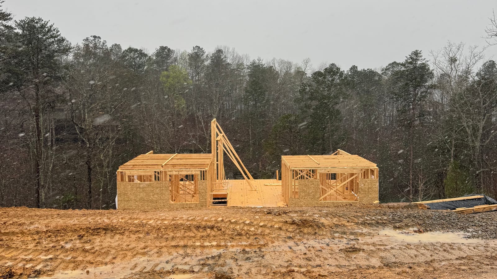 The framing going up on the cleared lot